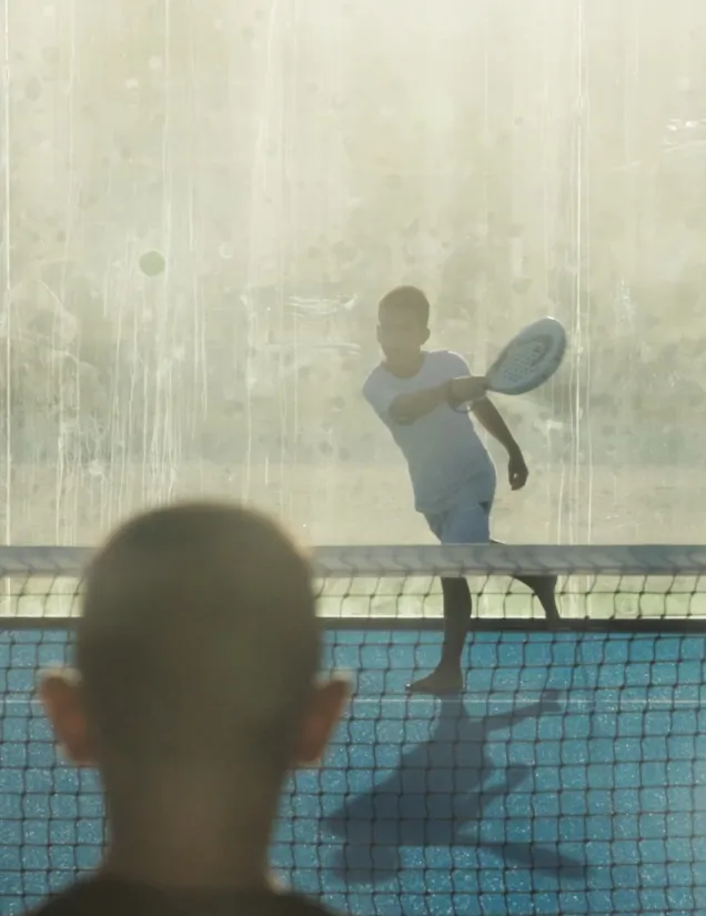 Child playing padel at Playfield Paros